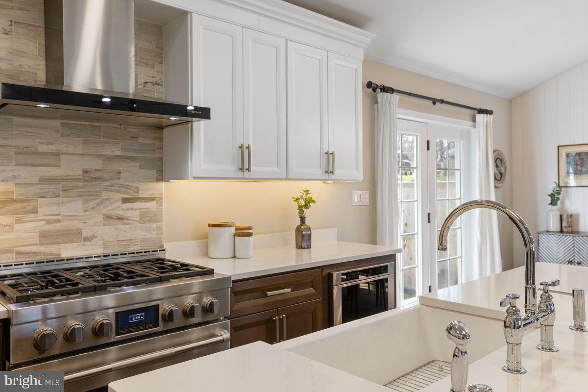 1401 Carol Road Jenkintown, PA 19046 - Photo 8 of 30 a kitchen with granite countertop a stove and a sink