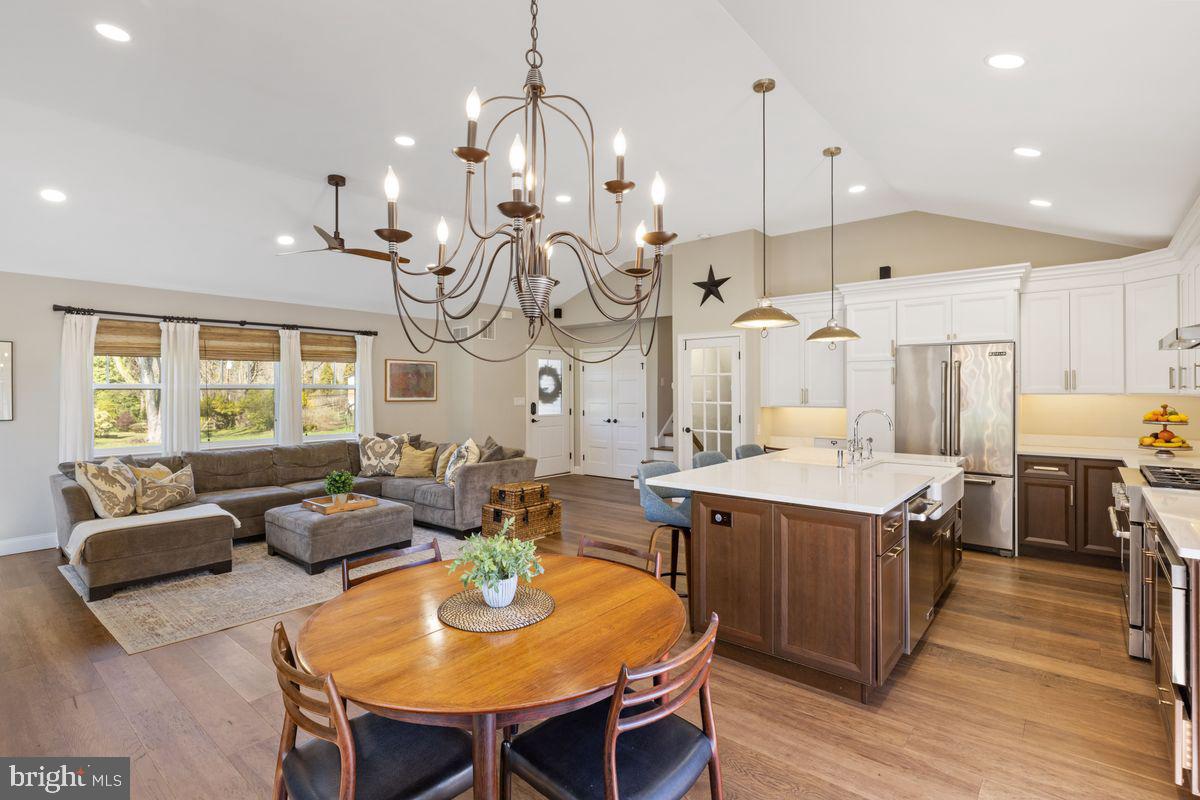 1401 Carol Road Jenkintown, PA 19046 - Photo 10 of 30 a very nice looking kitchen with a kitchen island stainless steel appliances furniture a large window and a chandelier