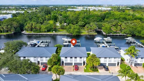 an aerial view of house with yard swimming pool and outdoor seating