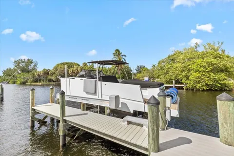 a view of a balcony with two chairs and a table