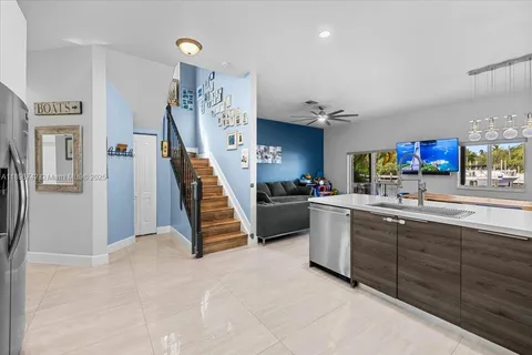 a kitchen with cabinets and window