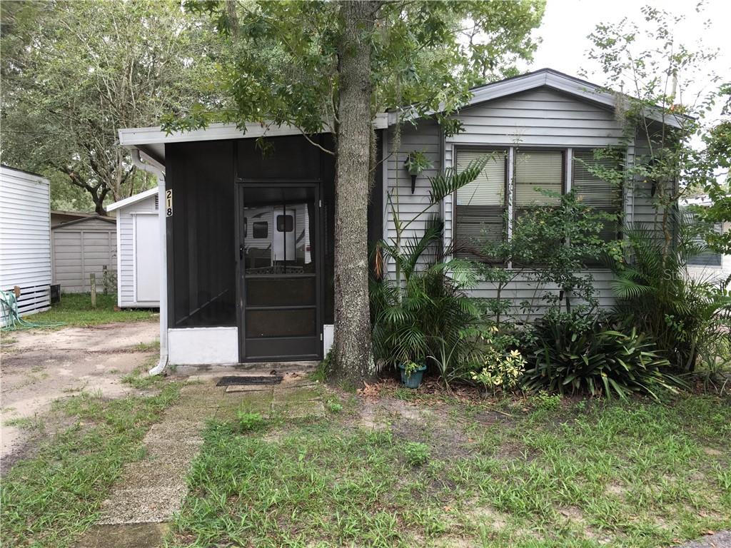 3000 Clarcona Road, Unit 218 Apopka, FL 32703 - Photo 1 of 1 a front view of a house with garden