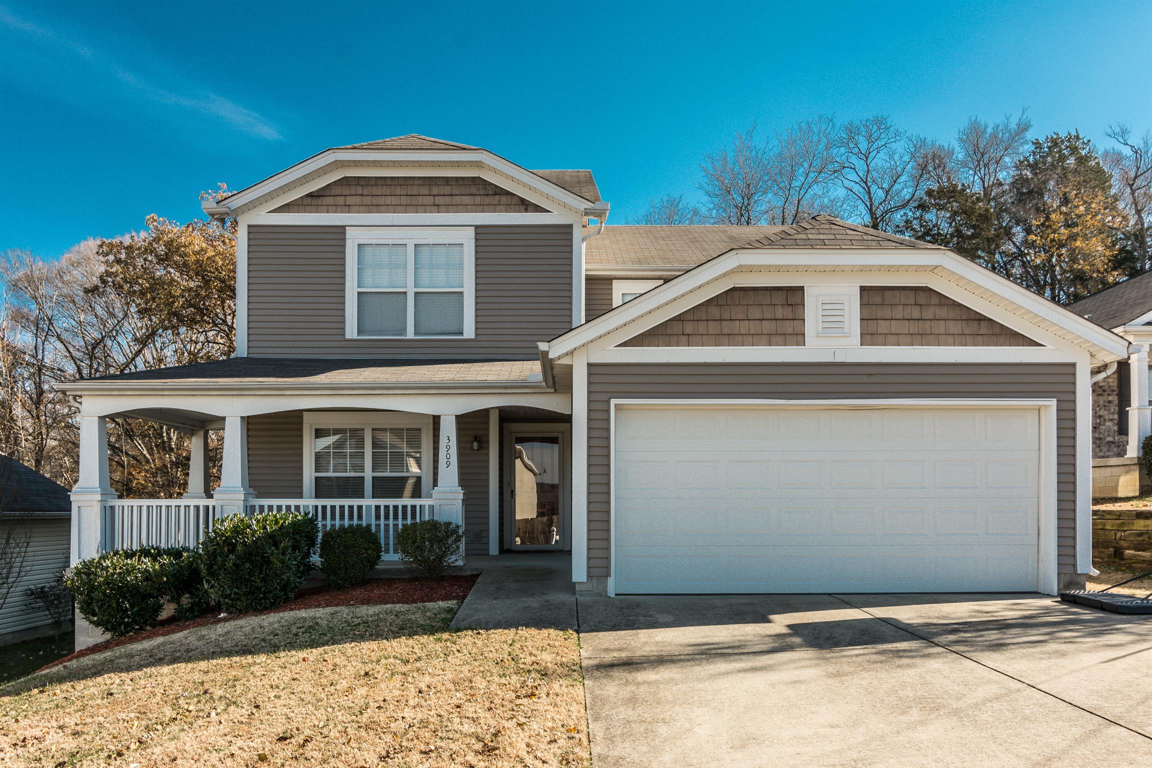 3909 Stephens Ridge Way Antioch, TN 37013 - Photo 1 of 25 a front view of a house with garden