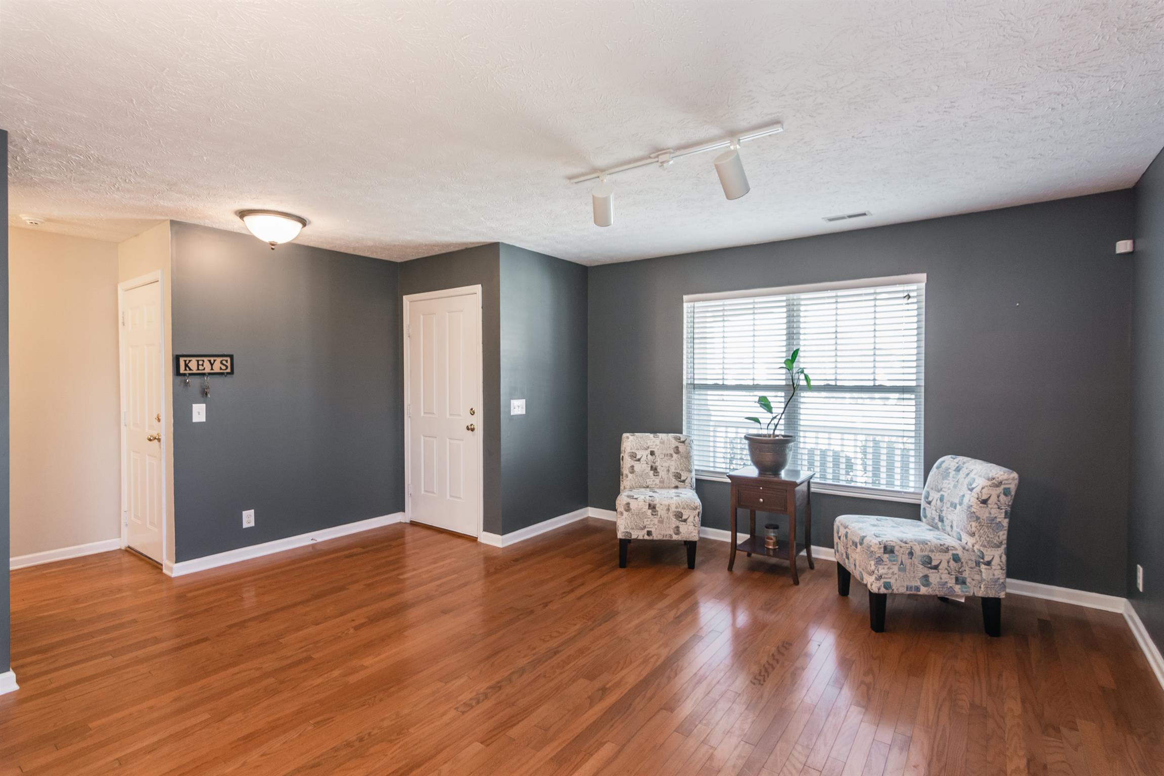3909 Stephens Ridge Way Antioch, TN 37013 - Photo 3 of 25 a living room with furniture and wooden floor