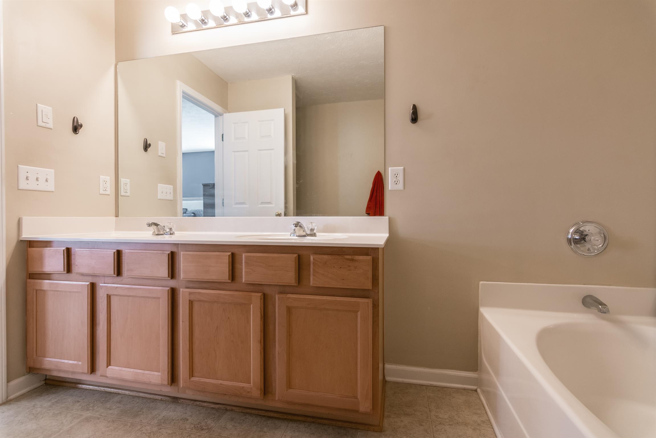 3909 Stephens Ridge Way Antioch, TN 37013 - Photo 22 of 25 a bathroom with a sink double vanity and a bathtub