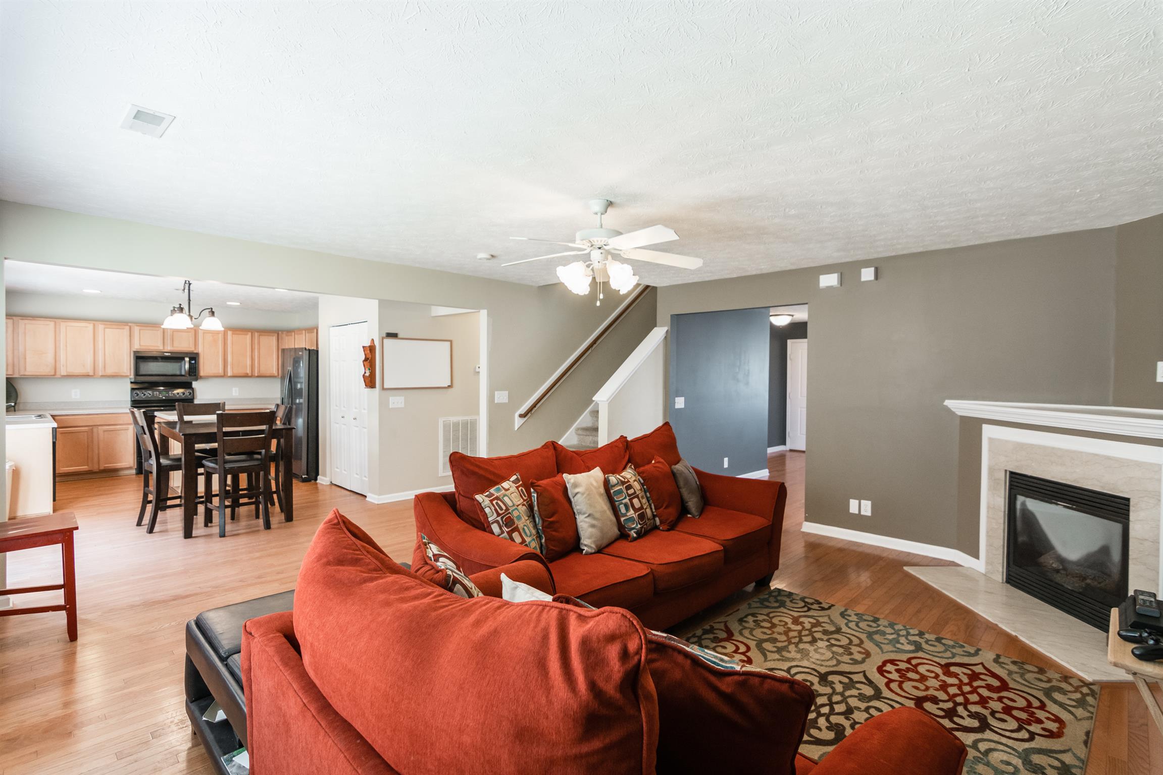 3909 Stephens Ridge Way Antioch, TN 37013 - Photo 5 of 25 a living room with furniture and a fireplace