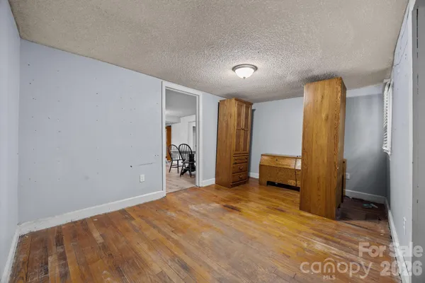 a view of room with window and ceiling fan