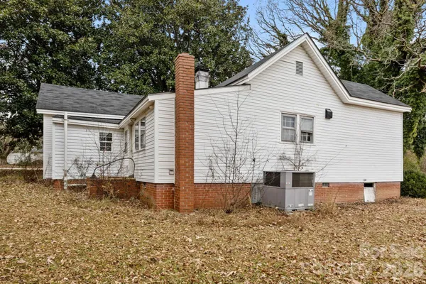 a front view of a house with large windows