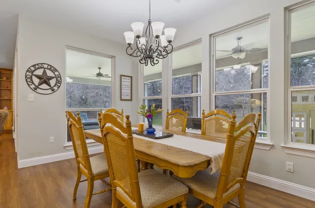 a dining room with furniture a livingroom and wooden floor