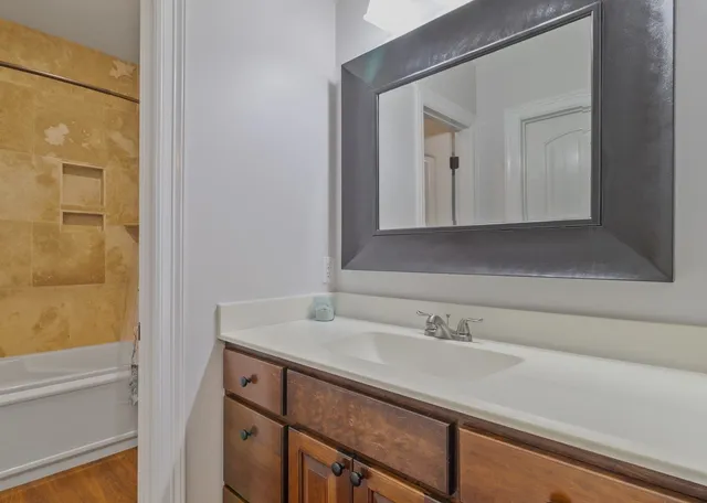 a bathroom with a sink and a mirror