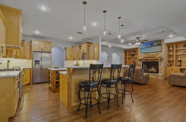 a view of dining room kitchen with furniture and wooden floor
