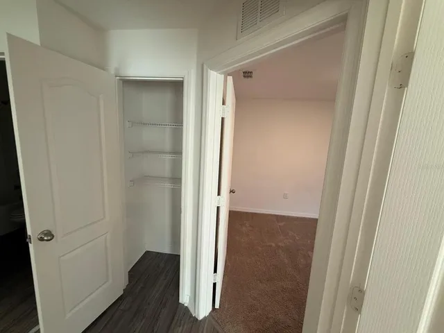 a bathroom with a sink a toilet a tub and shower