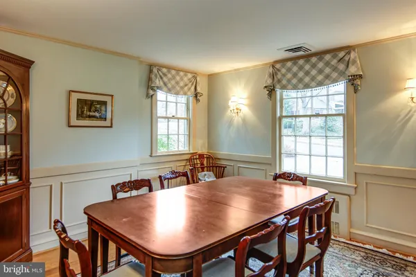 a view of a dining room with furniture and window
