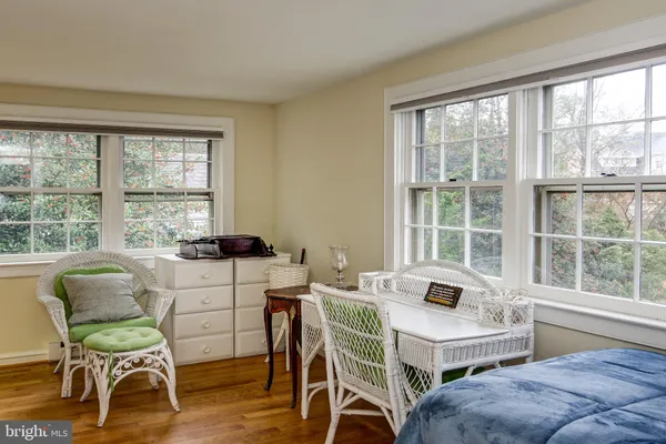 a bedroom with a bed and a table