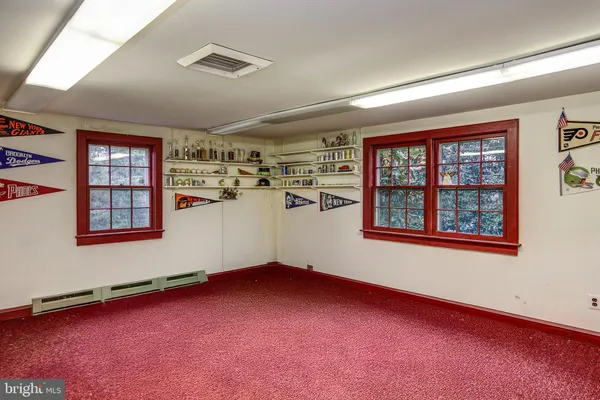 a dining room with furniture and a flat screen tv