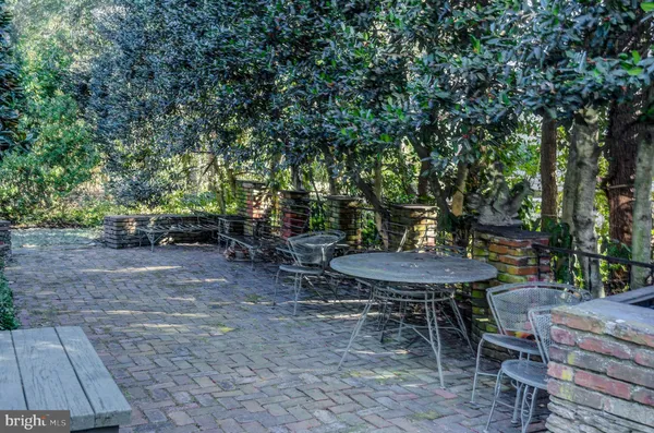 a view of a backyard with sitting area