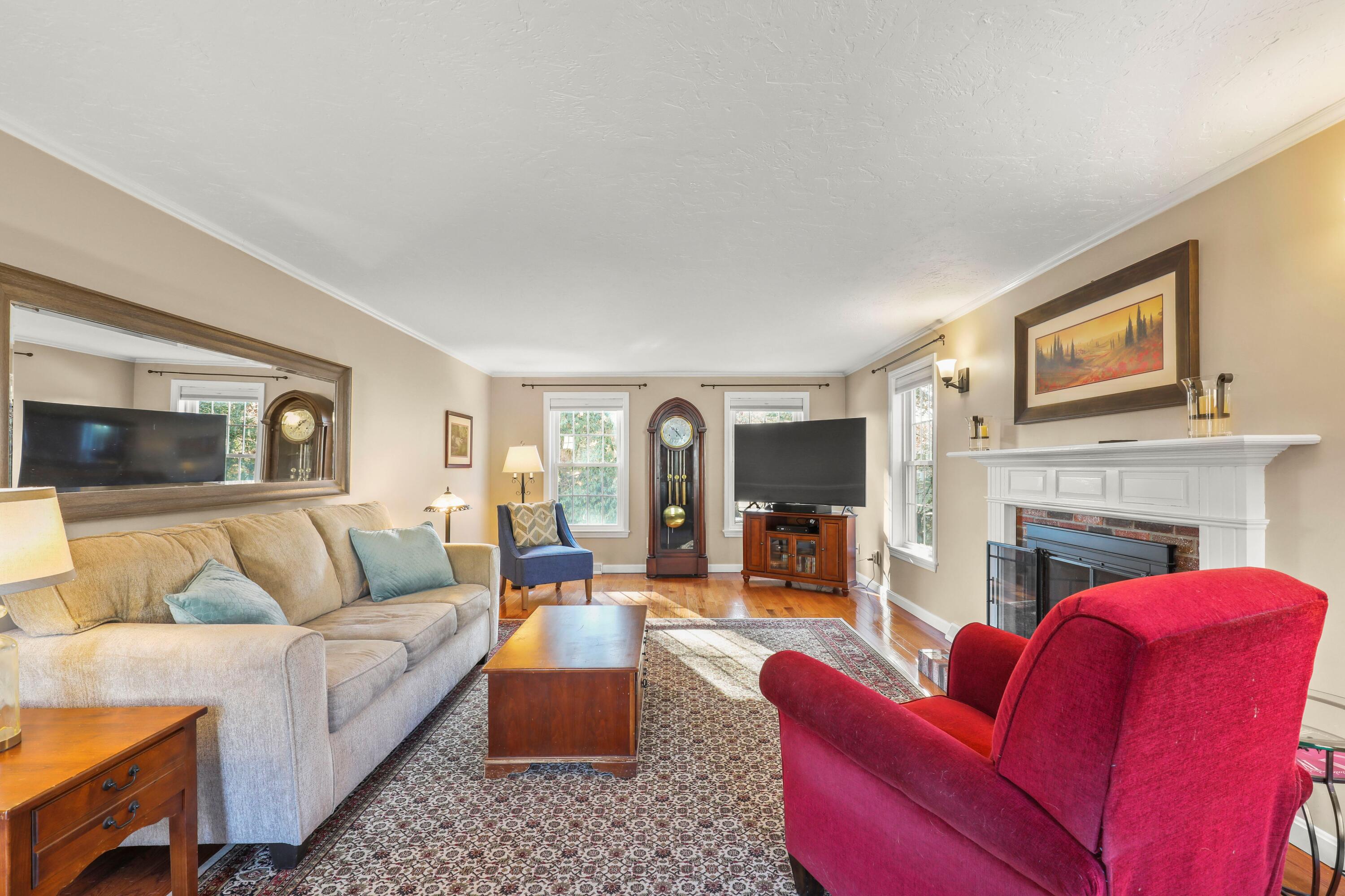 5 Vesper Drive Pocasset, MA 02559 - Photo 12 of 20 a living room with furniture and a fireplace