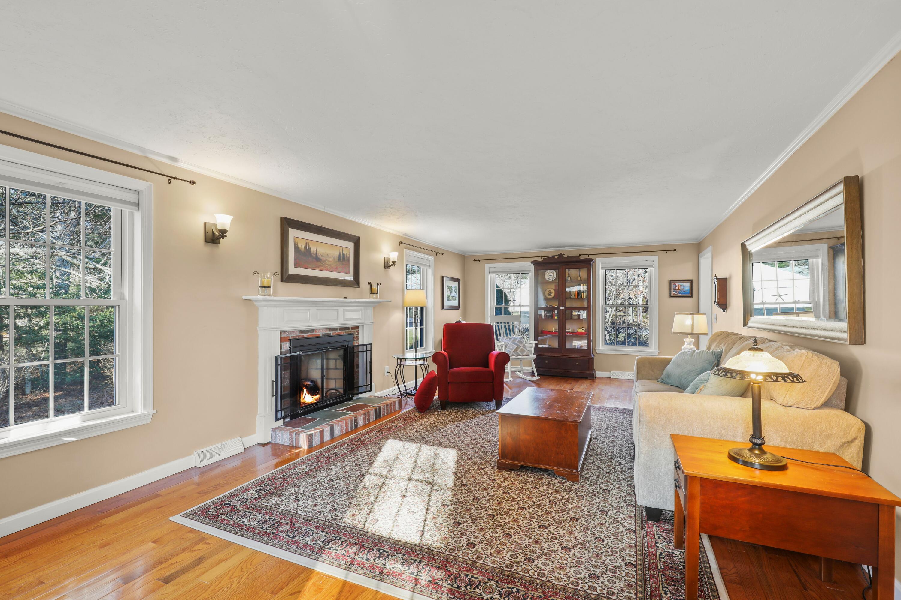 5 Vesper Drive Pocasset, MA 02559 - Photo 13 of 20 a living room with furniture large window and fireplace