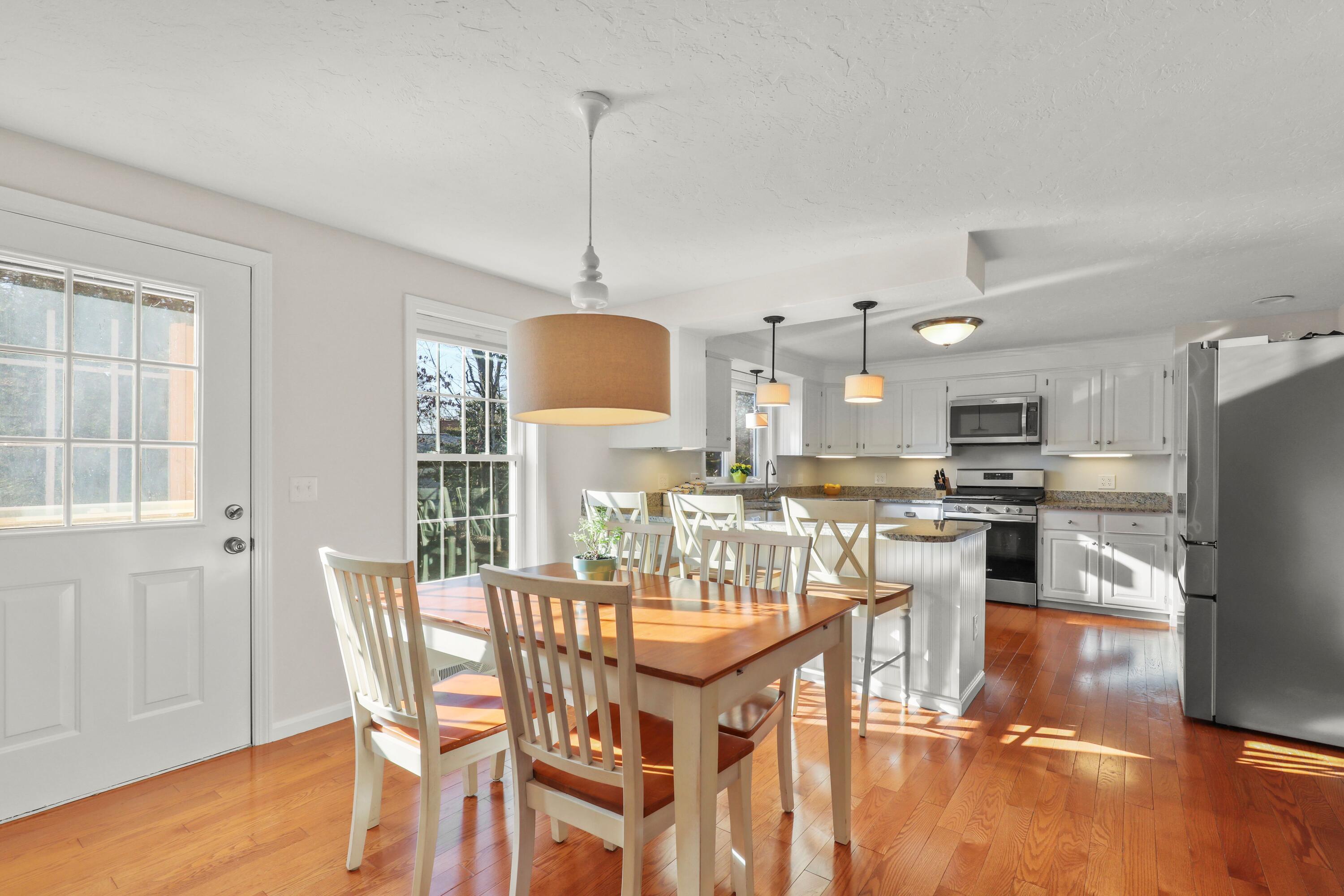 5 Vesper Drive Pocasset, MA 02559 - Photo 5 of 20 a dining room with furniture a chandelier and kitchen view