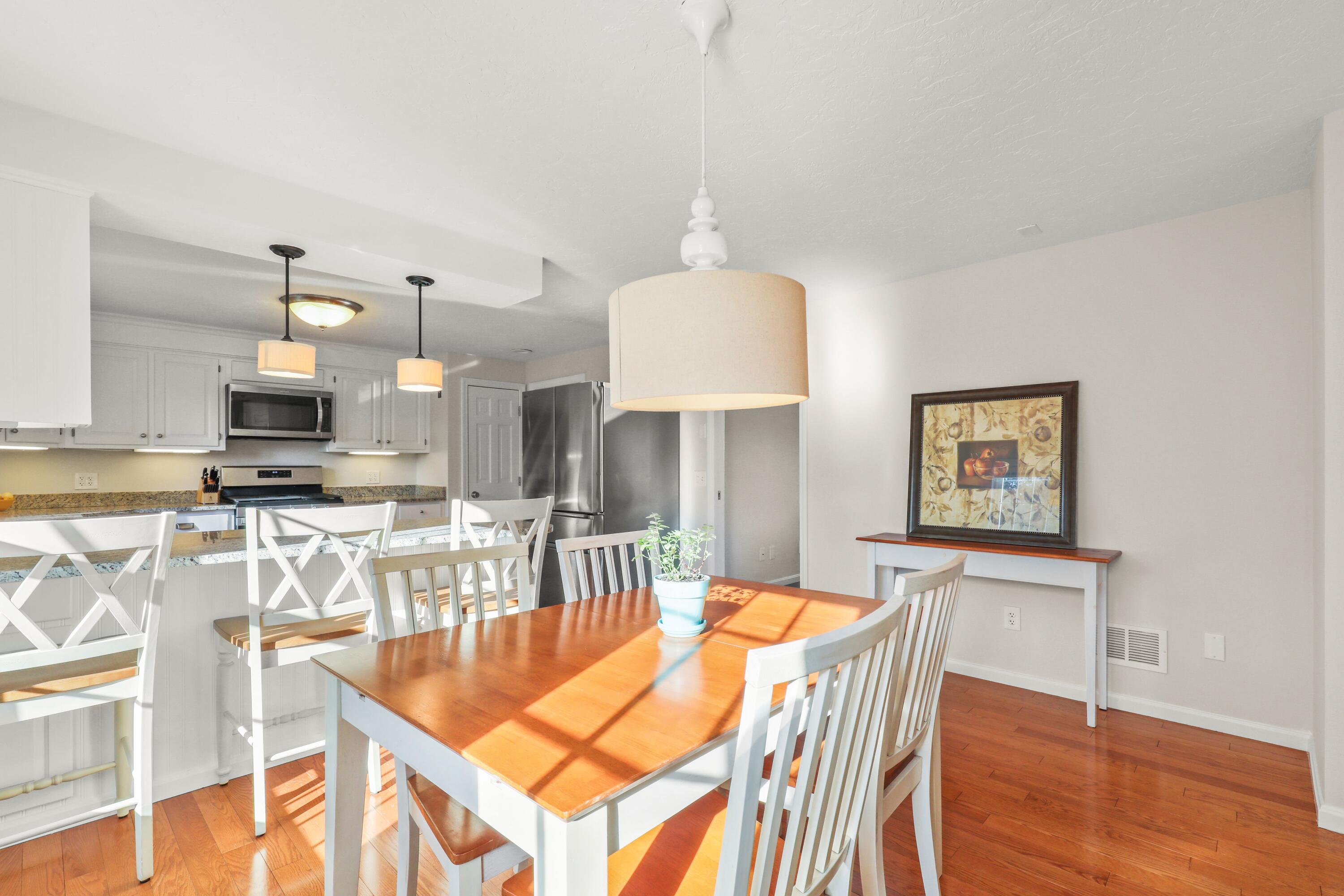 5 Vesper Drive Pocasset, MA 02559 - Photo 6 of 20 a view of a dining room with furniture and wooden floor