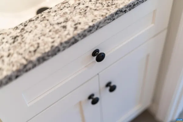 a view of a kitchen with wooden floor