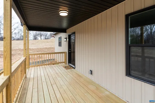 a view of balcony with wooden floor