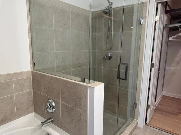 a bathroom with a sink vanity and mirror