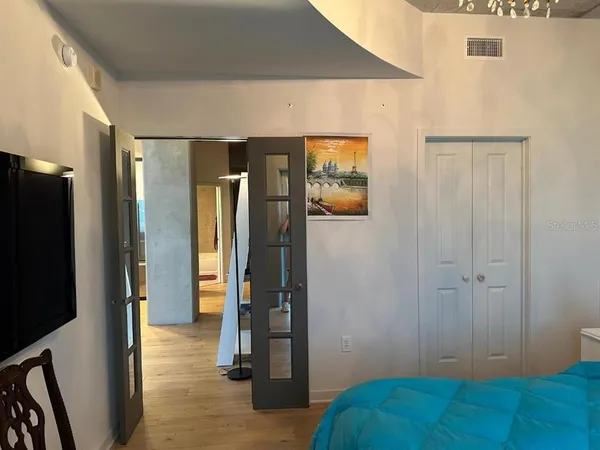 a living room with furniture and a floor to ceiling window