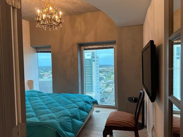 a kitchen with a sink cabinets and wooden floor