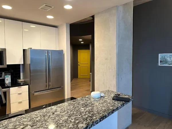 a bathroom with a glass door and shower