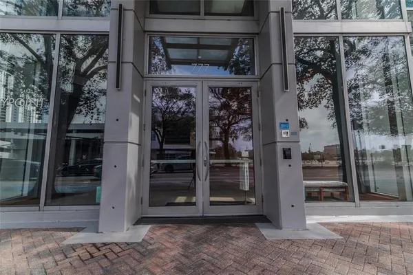an outdoor sitting area with brick walls and potted plants