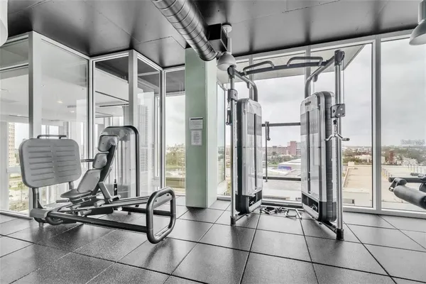 a backyard of a house with barbeque oven table and chairs
