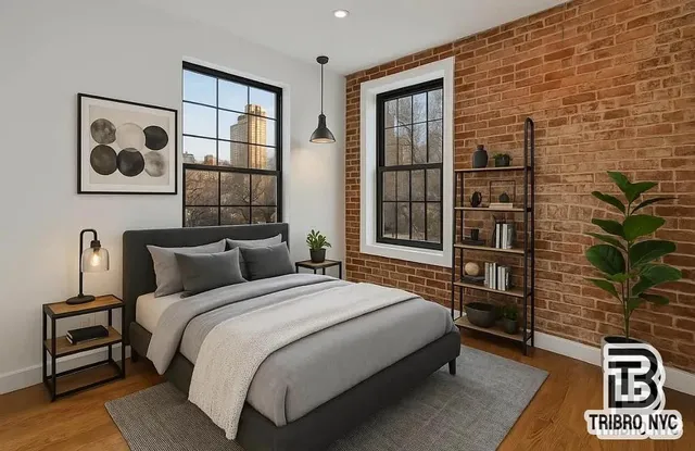 a bedroom with a bed and a potted plant on the dresser