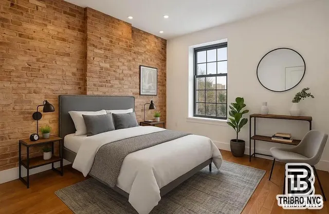 a bedroom with bed and a window