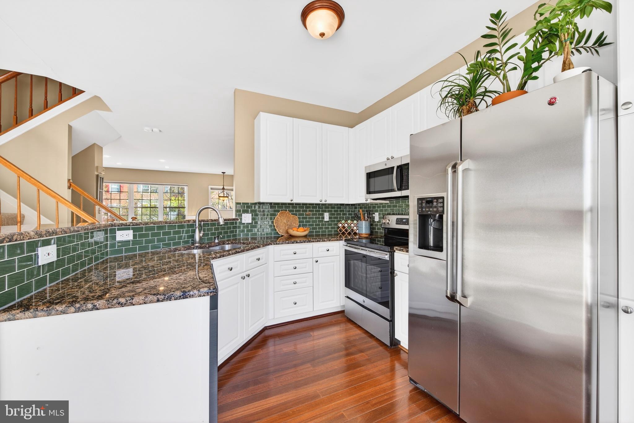 12017 Edgemere Circle Reston, VA 20190 - Photo 13 of 30 a kitchen with a refrigerator and a sink