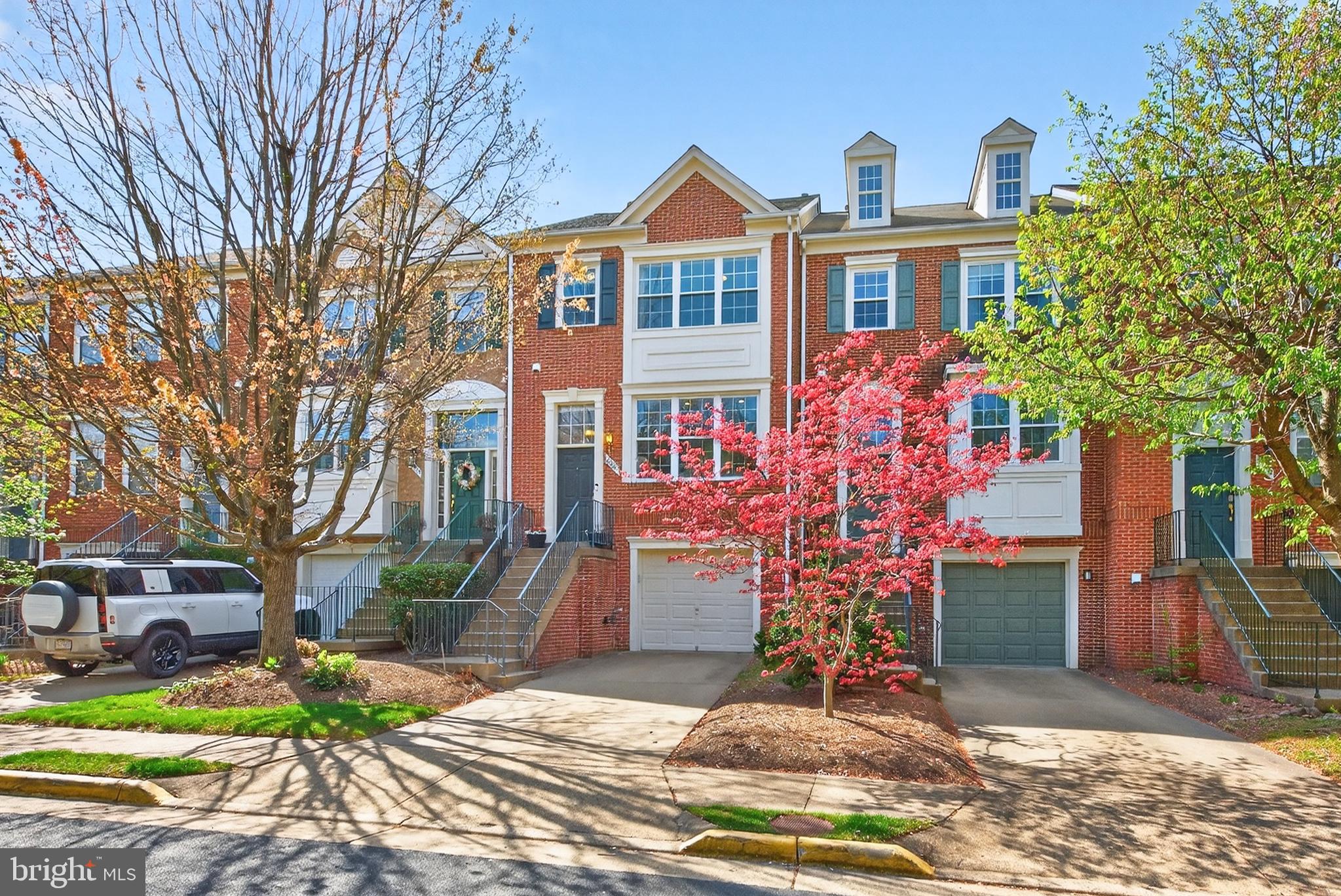 12017 Edgemere Circle Reston, VA 20190 - Photo 2 of 30 a front view of a house with garden