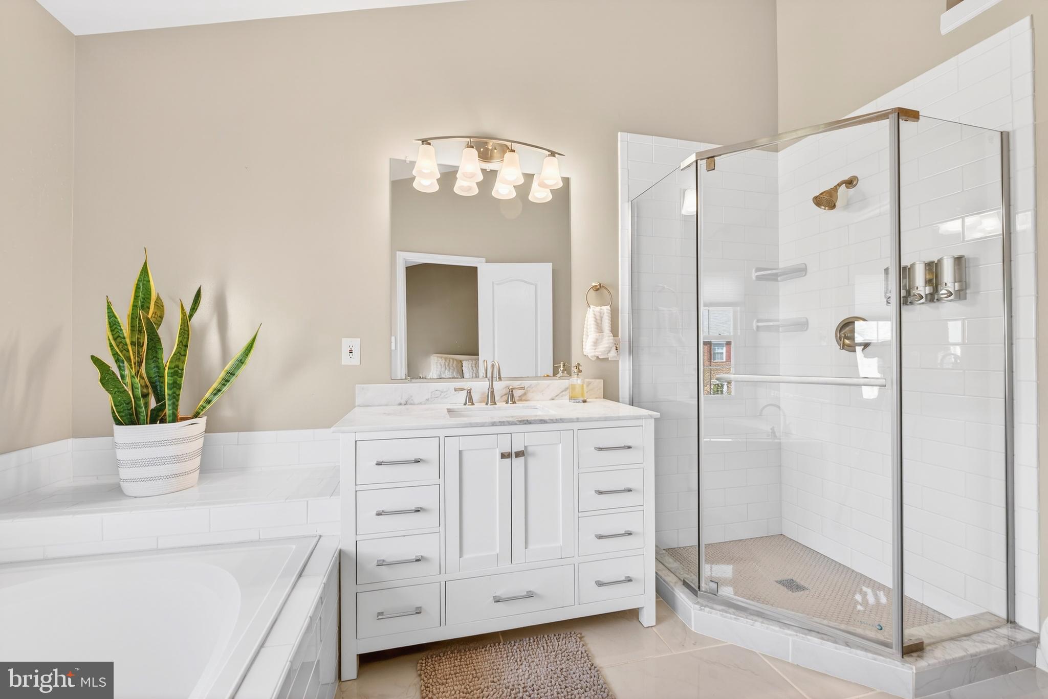 12017 Edgemere Circle Reston, VA 20190 - Photo 27 of 30 a bathroom with a double vanity sink mirror and shower