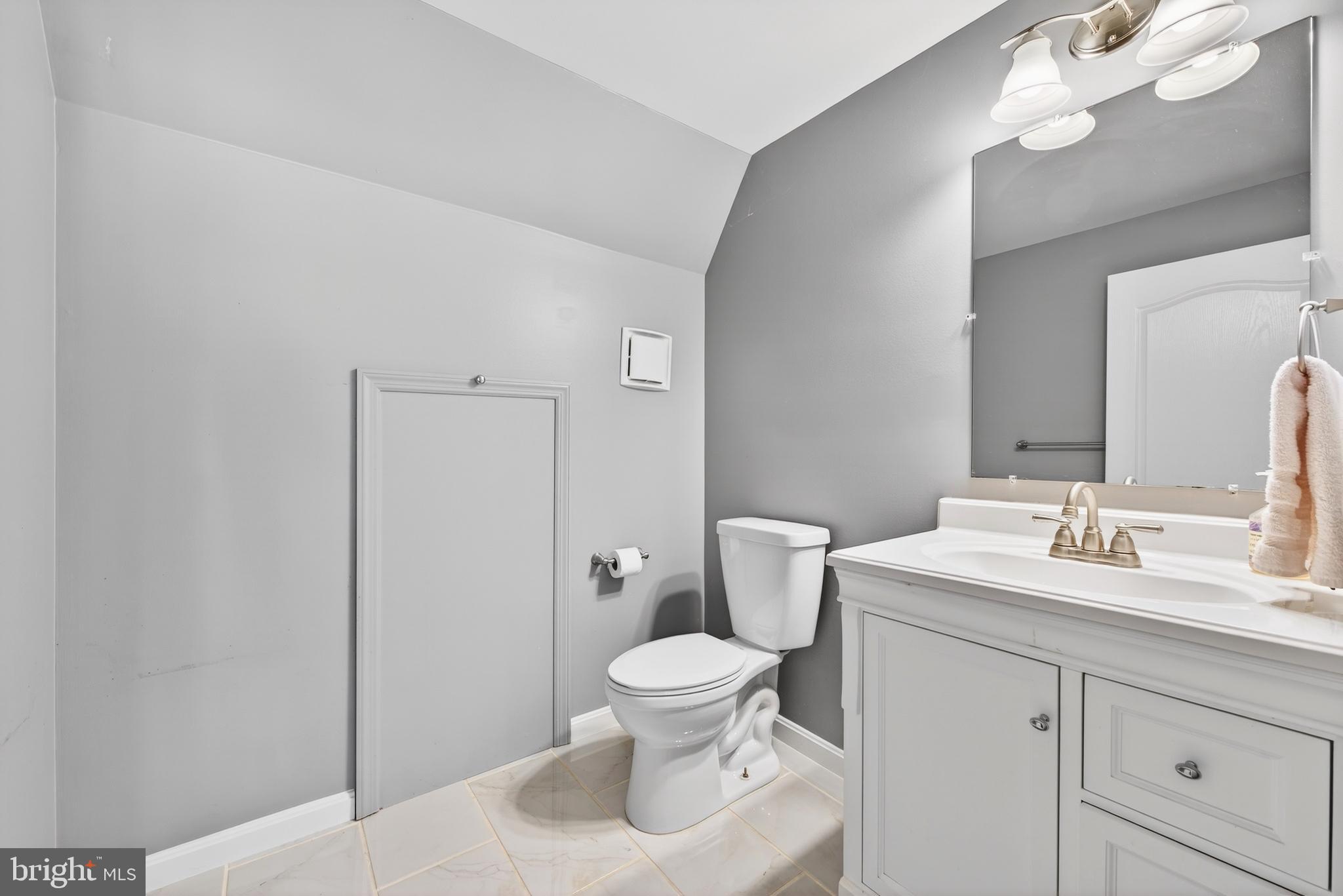 12017 Edgemere Circle Reston, VA 20190 - Photo 29 of 30 a bathroom with a toilet a sink and a mirror