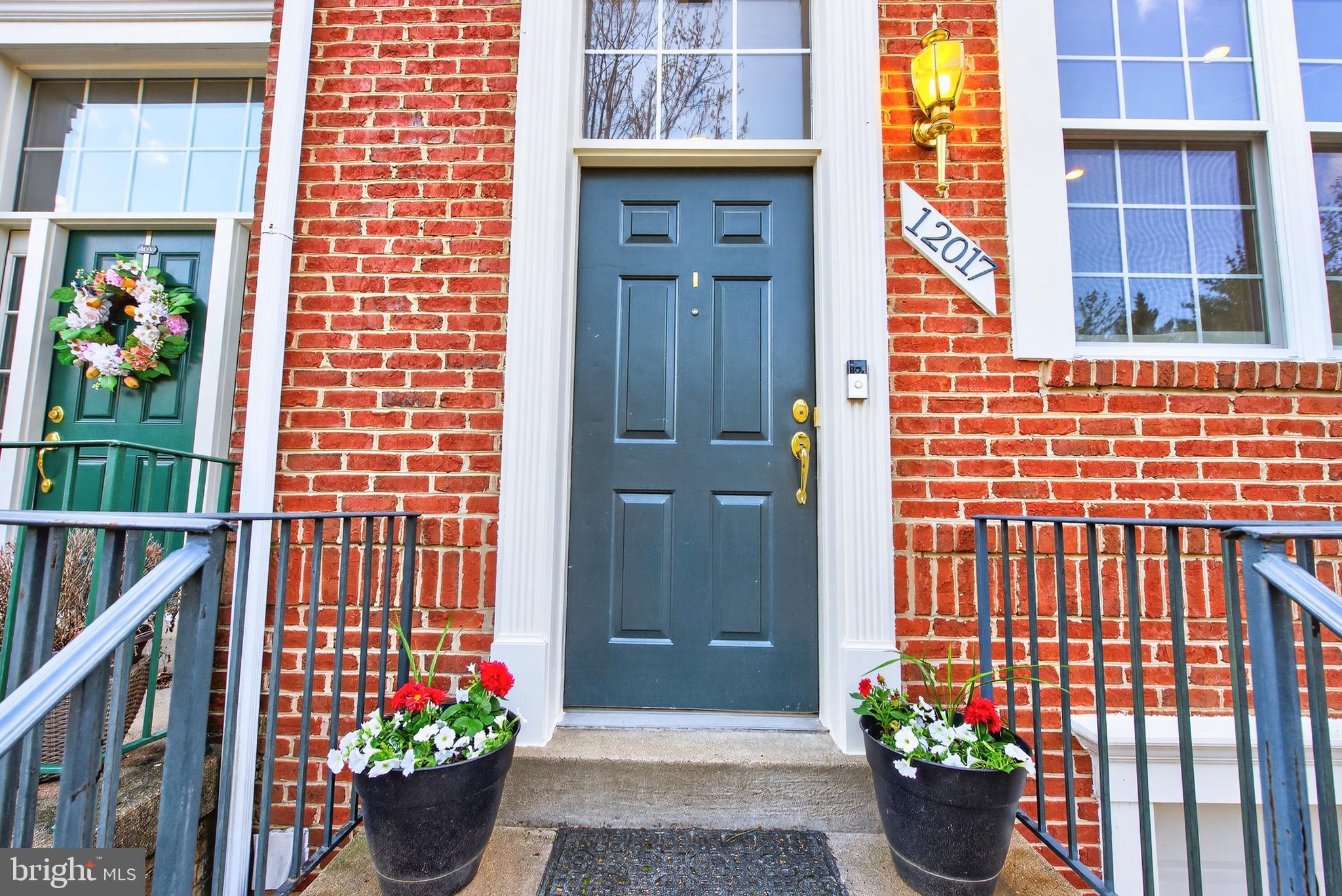 12017 Edgemere Circle Reston, VA 20190 - Photo 3 of 30 a front view of a house with a potted plant