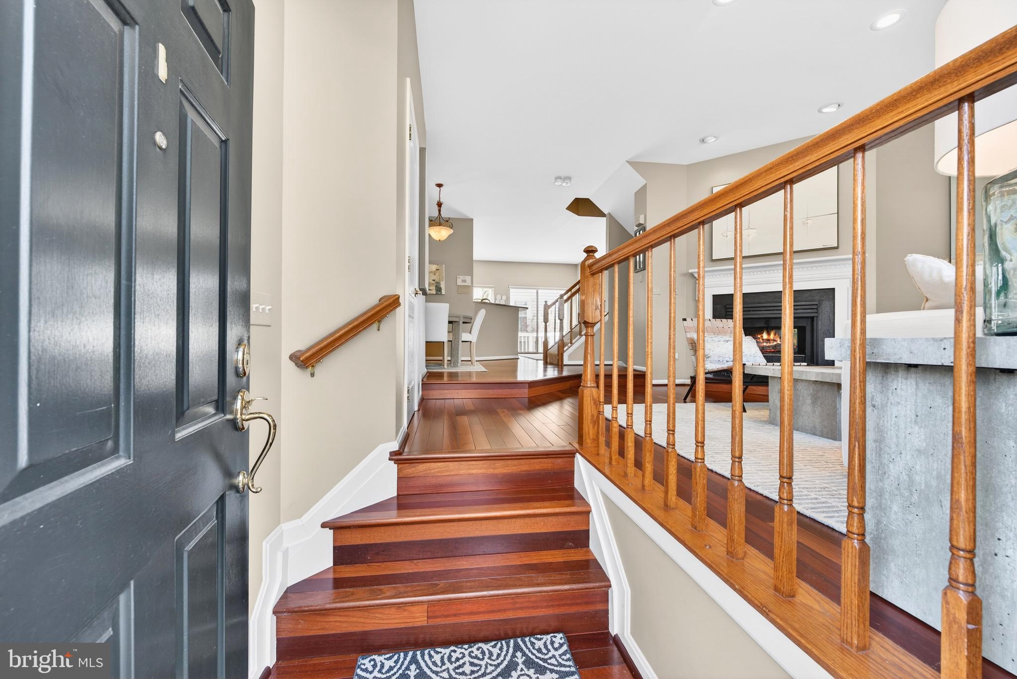 12017 Edgemere Circle Reston, VA 20190 - Photo 4 of 30 a view of staircase with lots of frames on wall and windows