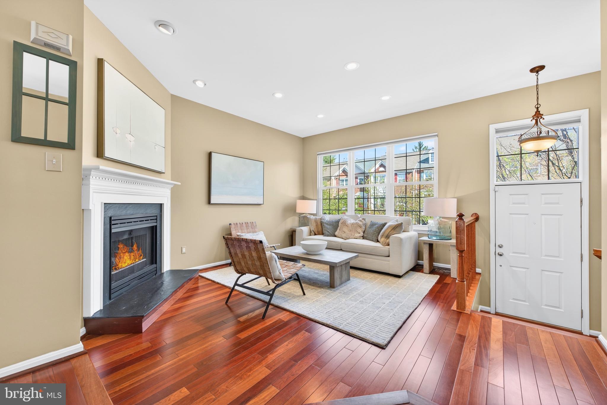 12017 Edgemere Circle Reston, VA 20190 - Photo 5 of 30 a living room with furniture and a fireplace