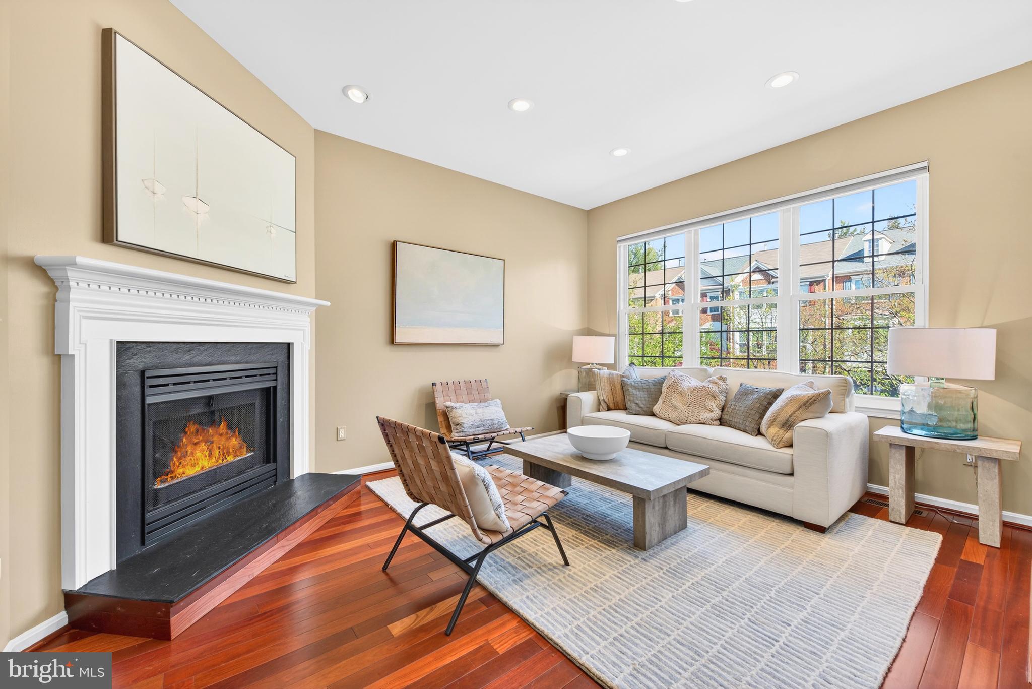 12017 Edgemere Circle Reston, VA 20190 - Photo 6 of 30 a living room with furniture and a fireplace