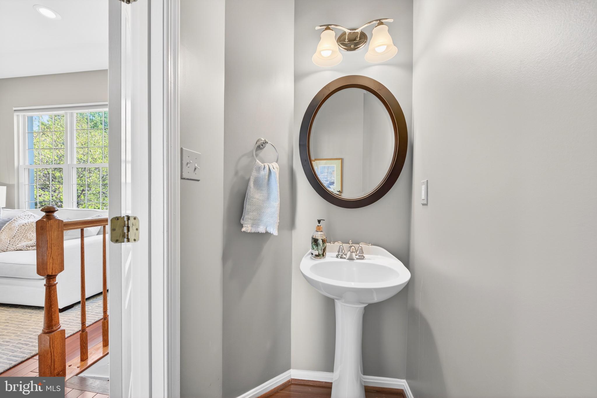 12017 Edgemere Circle Reston, VA 20190 - Photo 9 of 30 a bathroom with a sink and a mirror