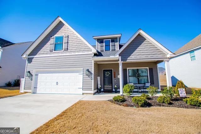 a view of an chairs and table in the balcony