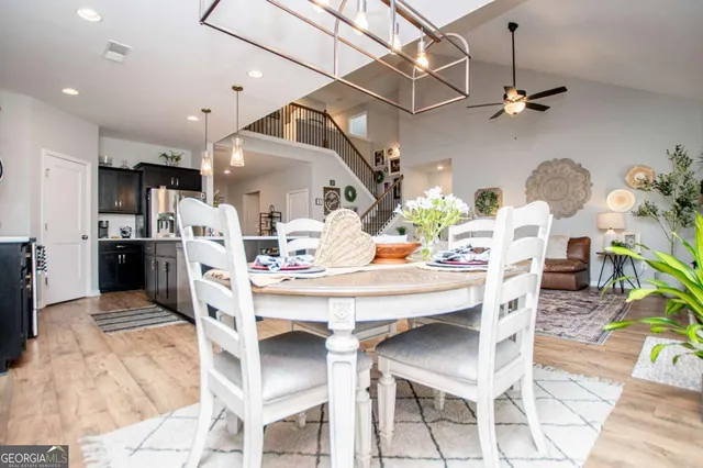 a living room with furniture and baby crib