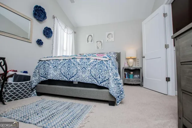 an aerial view of residential houses with outdoor space and swimming pool