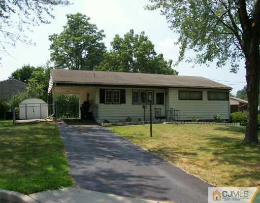 210 Princeton Road Old Bridge, NJ 08859 - Photo 1 of 8 a front view of a house with a yard balcony