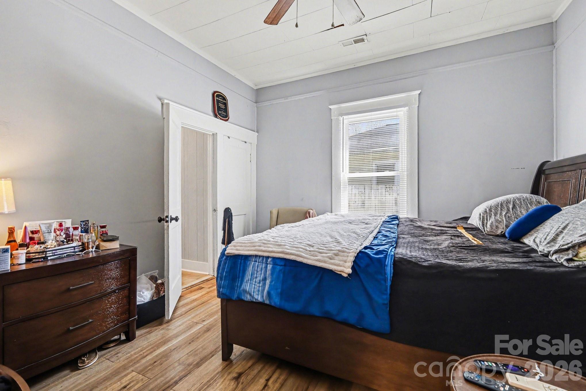 522 Elm Street Salisbury, NC 28144 - Photo 16 of 20 a bedroom with a bed and a dresser in it