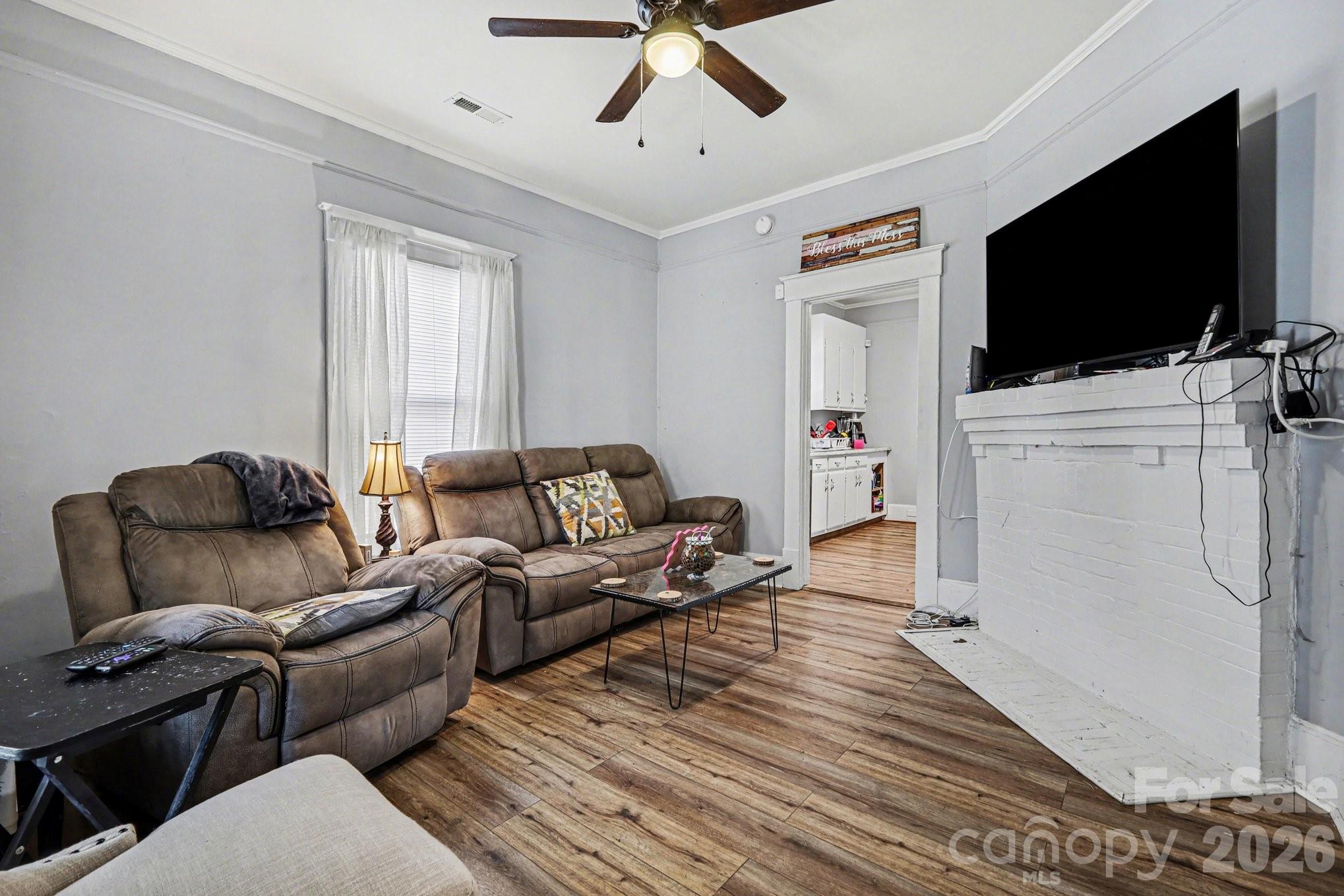 522 Elm Street Salisbury, NC 28144 - Photo 5 of 20 a living room with furniture and a flat screen tv
