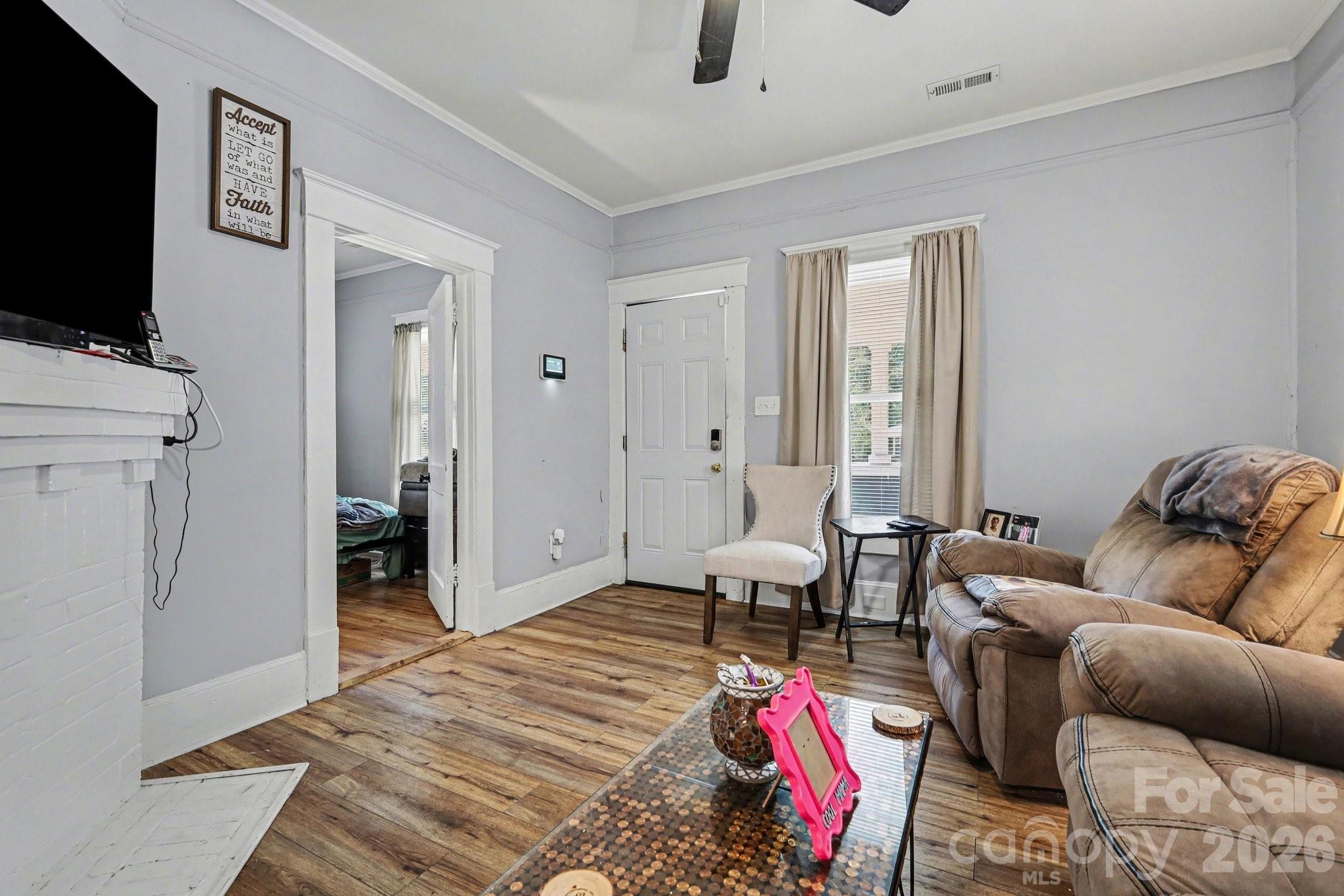 522 Elm Street Salisbury, NC 28144 - Photo 6 of 20 a living room with furniture and a flat screen tv